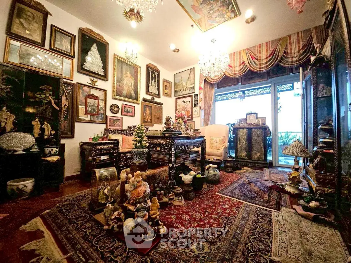 Luxurious living room with ornate decor, vintage furniture, and elegant chandeliers.