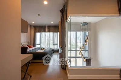 Modern bedroom with large windows and stylish lighting in a high-rise apartment.