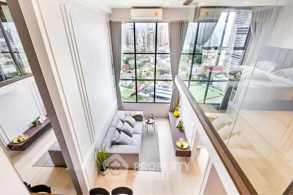 Stunning loft apartment with floor-to-ceiling windows and city view