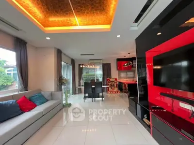 Spacious modern living room with elegant ceiling lights and large windows