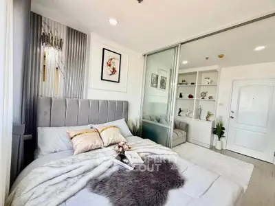 Luxurious bedroom with elegant decor and cozy ambiance, featuring a plush bed and stylish shelving.