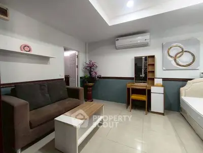 Cozy living room with modern furniture and air conditioning