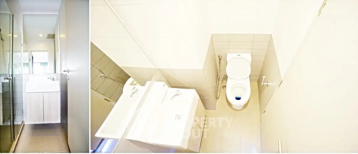 Modern bathroom with dual sinks and glass shower enclosure