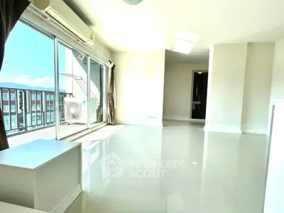 Bright and spacious living room with large balcony and natural light