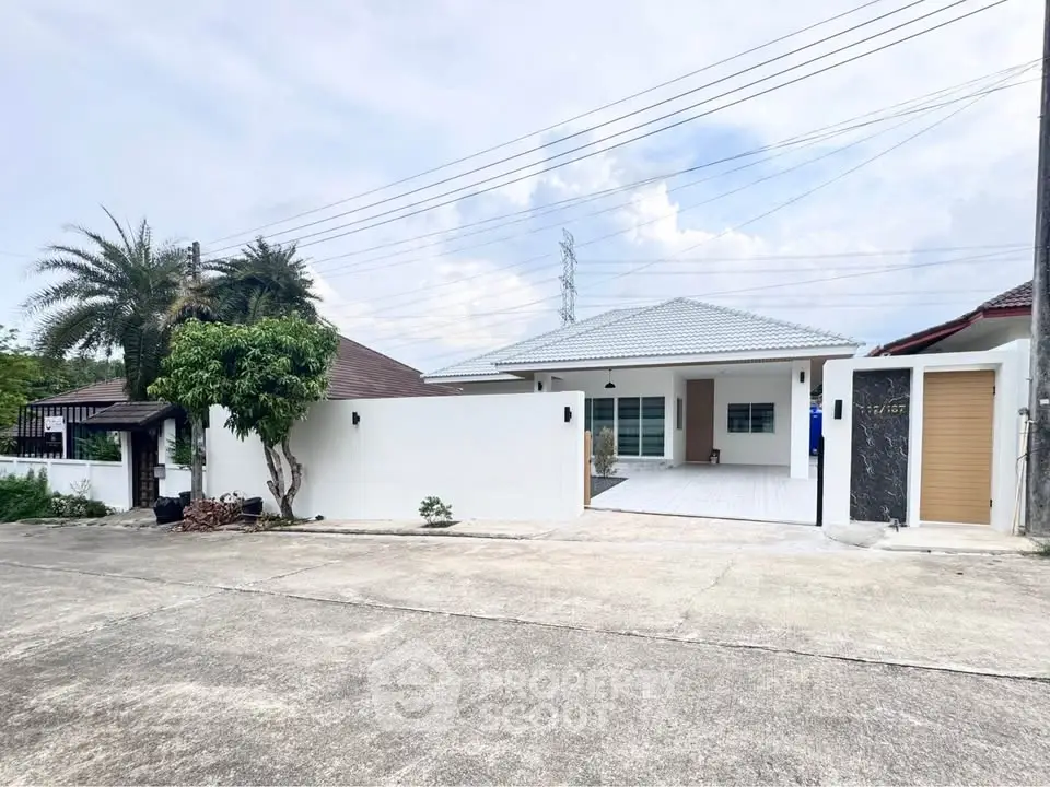 Charming single-story home with modern design and spacious driveway