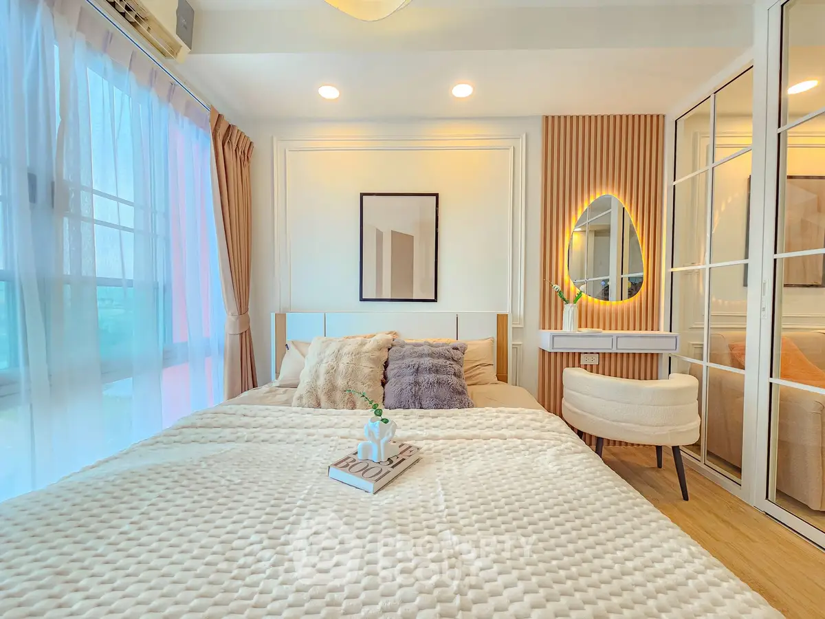 Luxurious bedroom with elegant decor and natural light in modern apartment