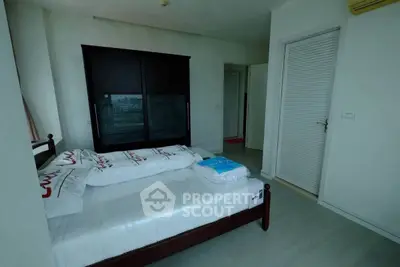 Cozy bedroom with modern wardrobe and natural light