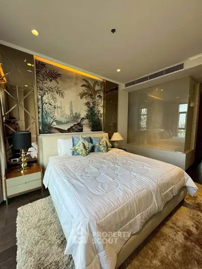 Luxurious bedroom with elegant decor and plush bedding in a modern apartment.