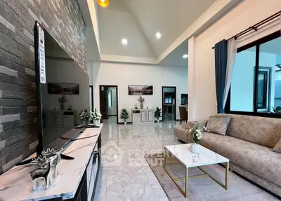 Spacious modern living room with elegant decor and large windows