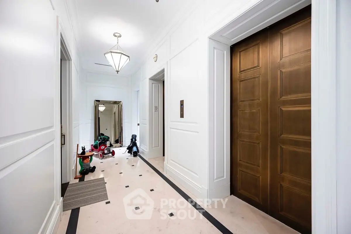 Luxurious apartment hallway with elegant elevator and chic decor