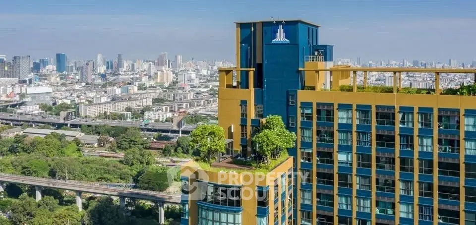 Stunning cityscape view from a modern high-rise building with lush rooftop garden.