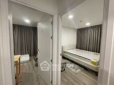 Modern apartment interior with bedroom and living area, featuring sleek design and cozy ambiance.