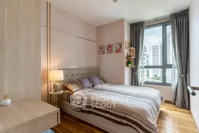 Modern bedroom with large window and stylish decor in urban apartment