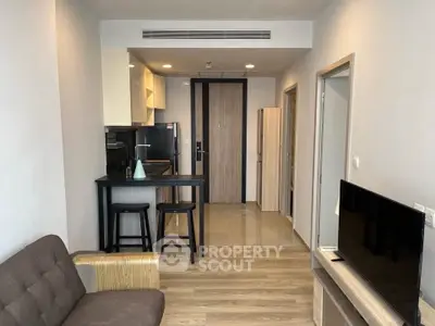 Modern apartment interior with open kitchen and cozy living area