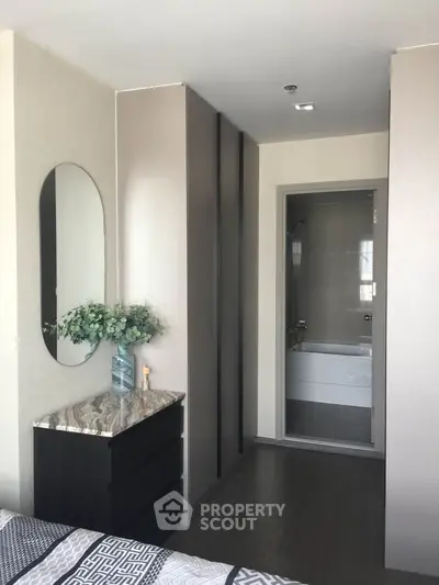 Modern bedroom with ensuite bathroom and stylish decor