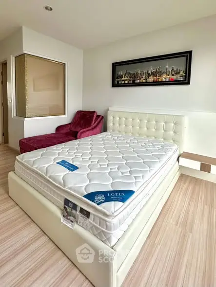 Modern bedroom with stylish decor and comfortable mattress in a cozy apartment.