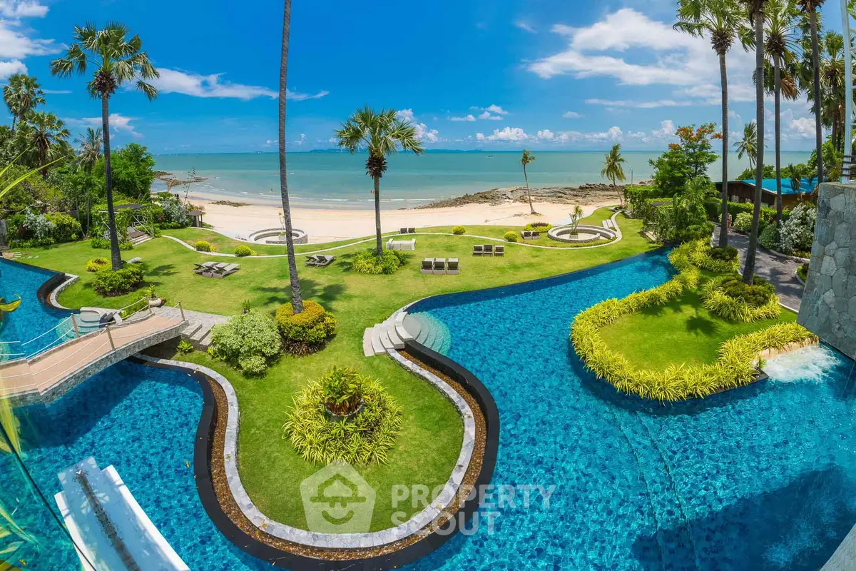 Luxurious beachfront property with stunning pool and lush gardens offering breathtaking ocean views.