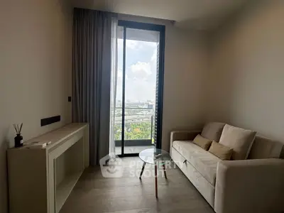 Modern living room with a stunning city view from a large window, featuring a cozy sofa and sleek decor.