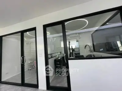Modern office space with glass partitions and sleek design