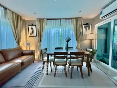 Stylish living room with elegant dining area and modern decor