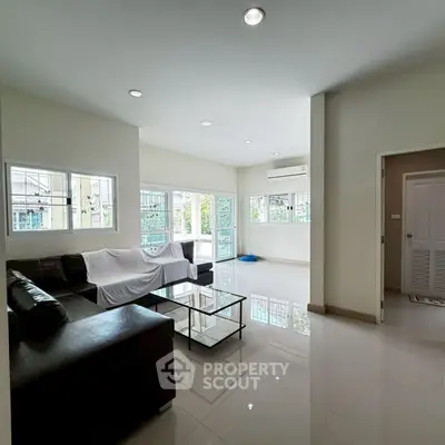 Spacious living room with modern furniture and natural light