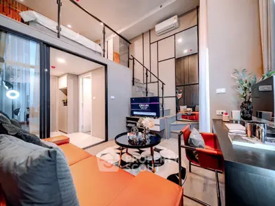 Modern loft-style living room with mezzanine and stylish decor