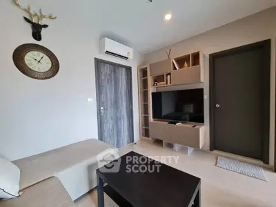 Modern living room with sleek furniture and stylish decor in a contemporary apartment.