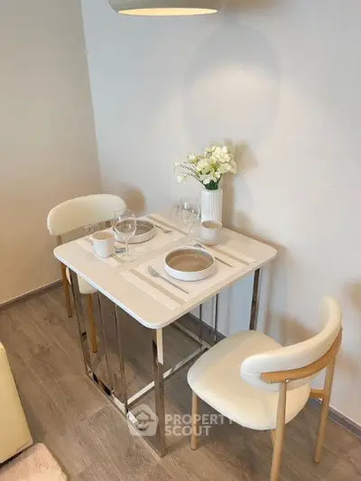 Cozy dining nook with modern table and chairs, perfect for intimate meals.