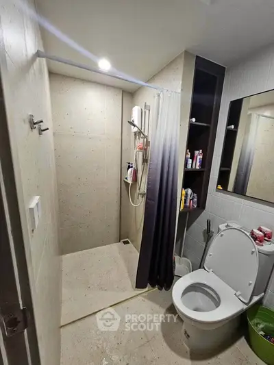 Modern bathroom with shower and toilet in sleek design