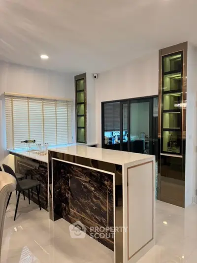 Luxurious modern kitchen with sleek marble island and elegant cabinetry
