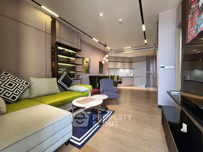 Luxurious modern living room with stylish furniture and open kitchen layout