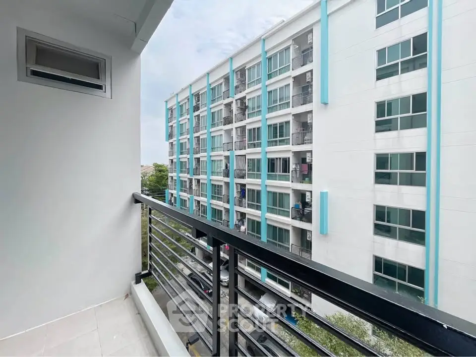 Modern apartment balcony with view of contemporary building exterior