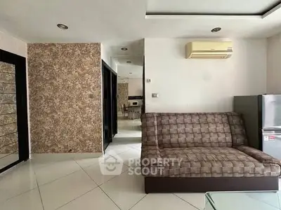 Modern living room with stylish sofa and air conditioning unit