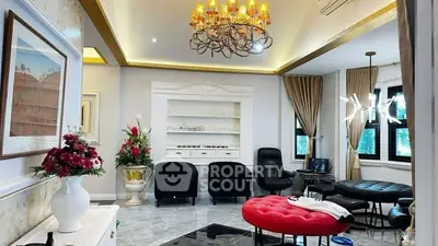 Luxurious living room with elegant chandelier and modern decor