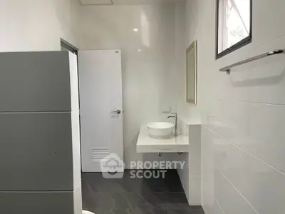 Modern bathroom with sleek design and white fixtures