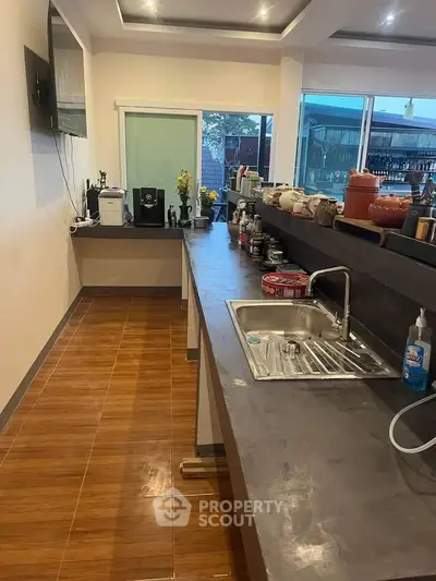 Modern kitchen with sleek countertops and ample natural light