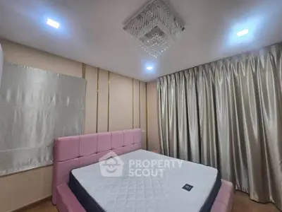 Luxurious bedroom with elegant decor and plush pink headboard