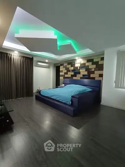 Modern bedroom with unique ceiling design and stylish decor