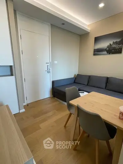 Modern living room with cozy sofa and dining area in stylish apartment