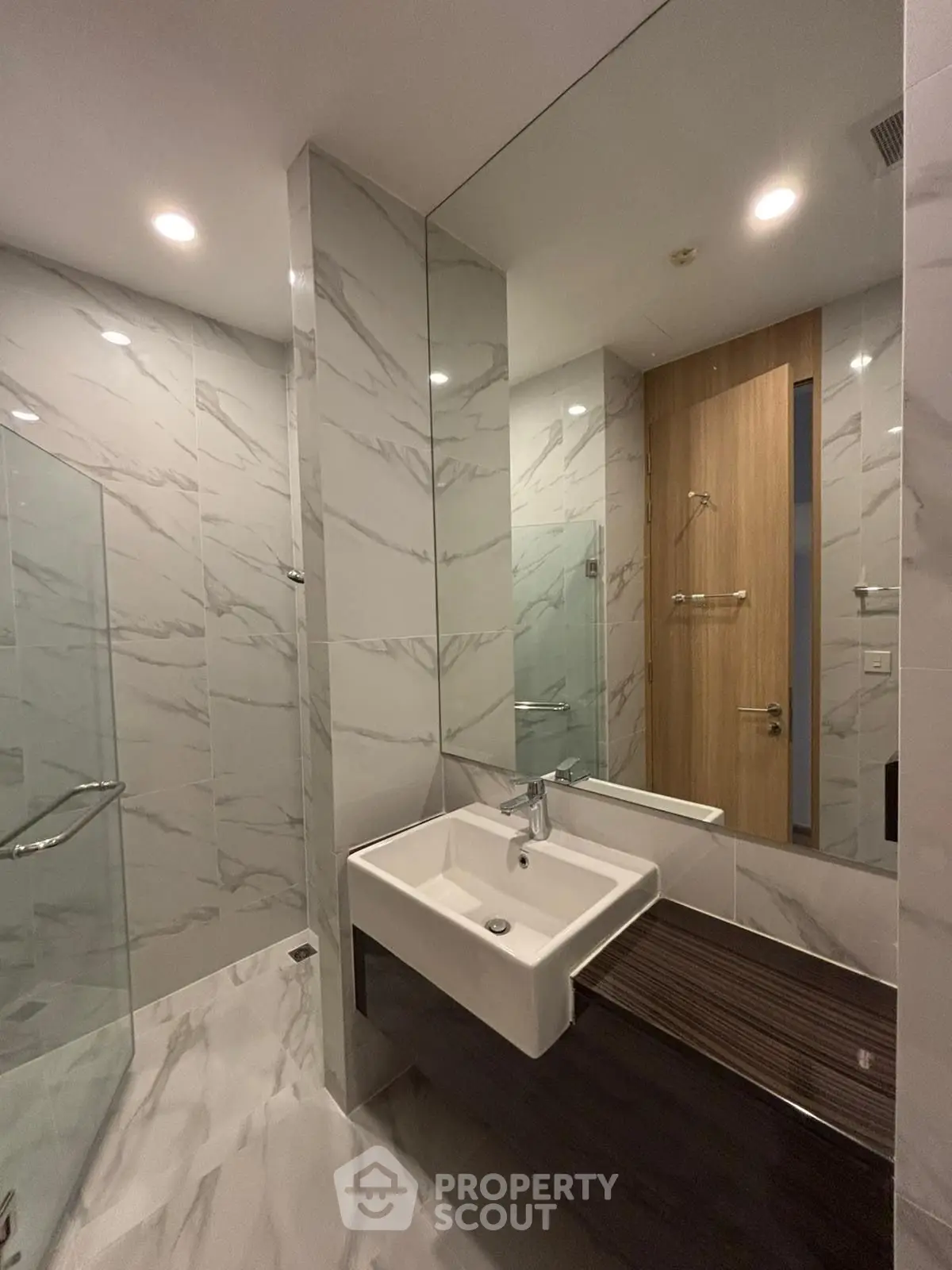 Modern bathroom with sleek marble tiles and stylish sink design