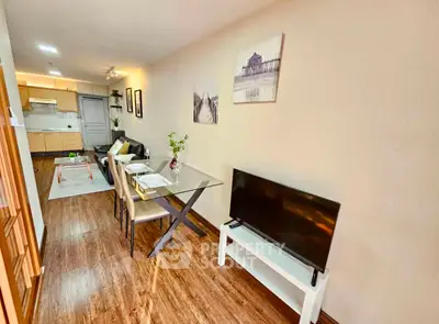 Modern living room with open kitchen and stylish decor in a cozy apartment.
