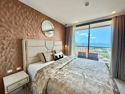 Luxurious bedroom with stunning ocean view and elegant decor