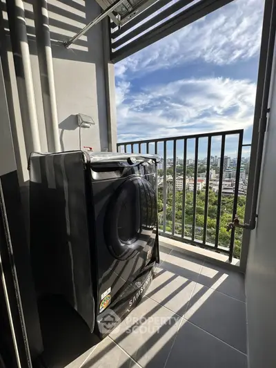 Modern balcony with washing machine and stunning city view, perfect for urban living.