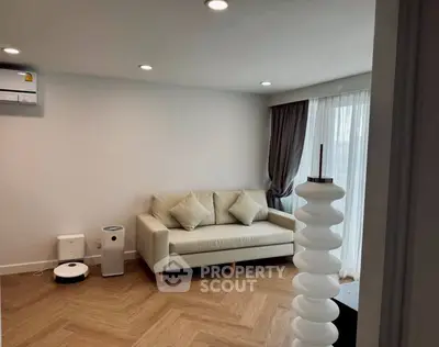 Modern living room with cozy sofa and stylish lighting