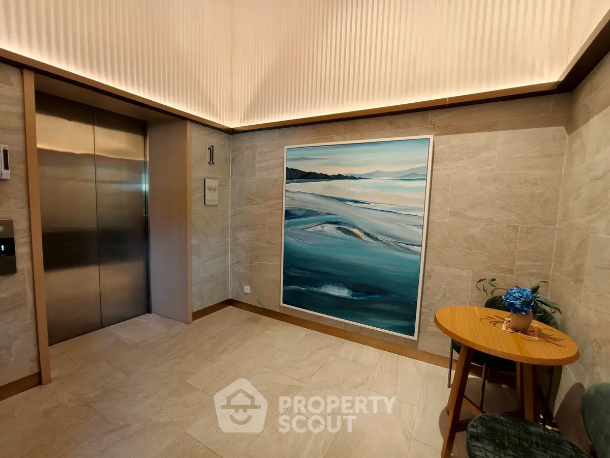 Elegant elevator lobby with modern art and stylish decor