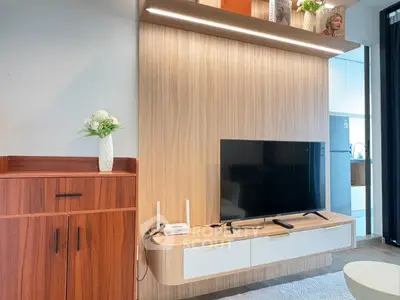 Modern living room with sleek TV setup and stylish wooden cabinetry