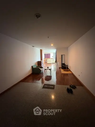 Spacious living room with parquet flooring and modern furniture