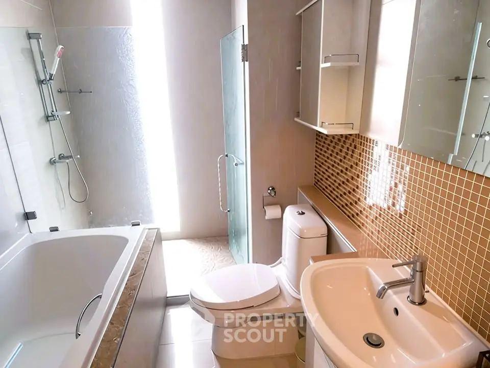 Modern bathroom with sleek fixtures and stylish tile accents