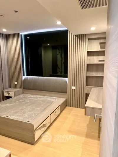 Modern bedroom with built-in shelves and stylish wood paneling