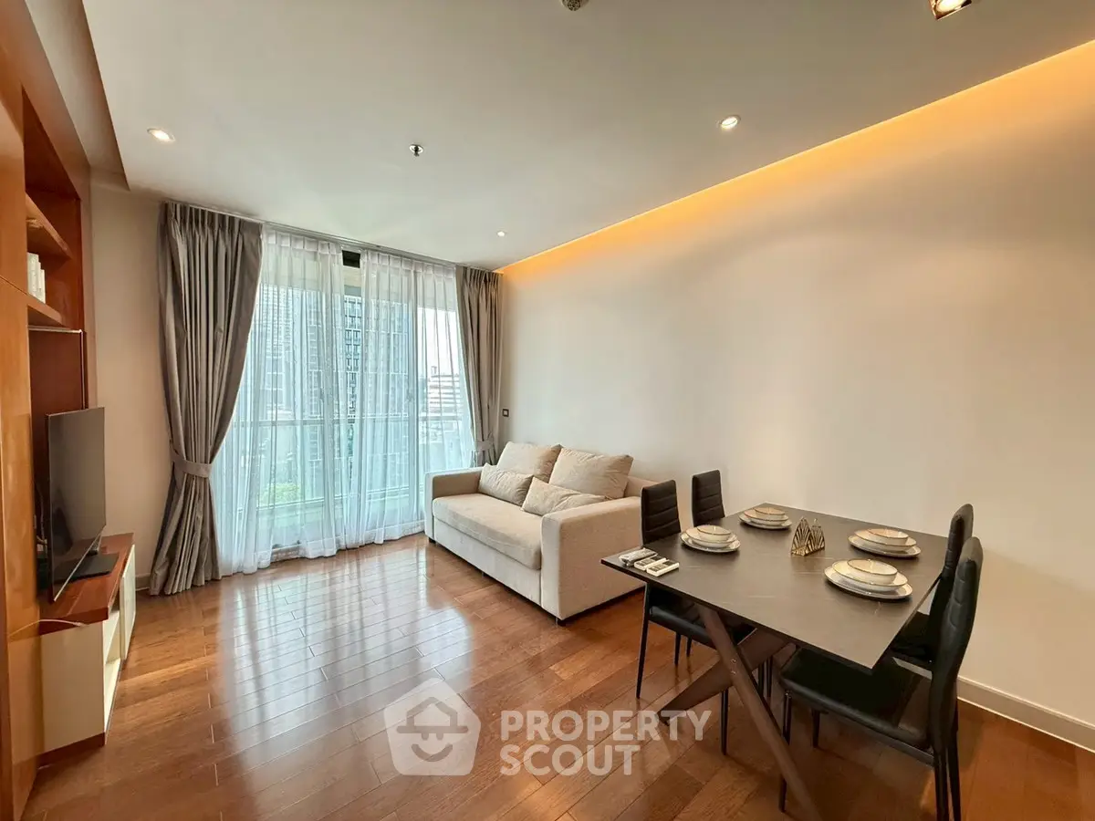 Spacious modern living room with elegant dining area and large window view.